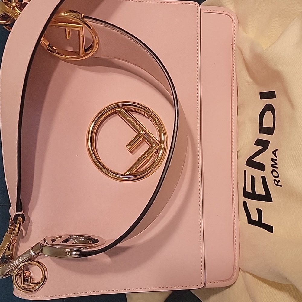 Fendi women handbag. As good as new. Beautiful baby pink with gold hardware.